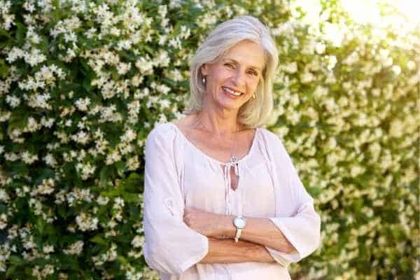 Older woman happy with urinary incontinence treatment Bow